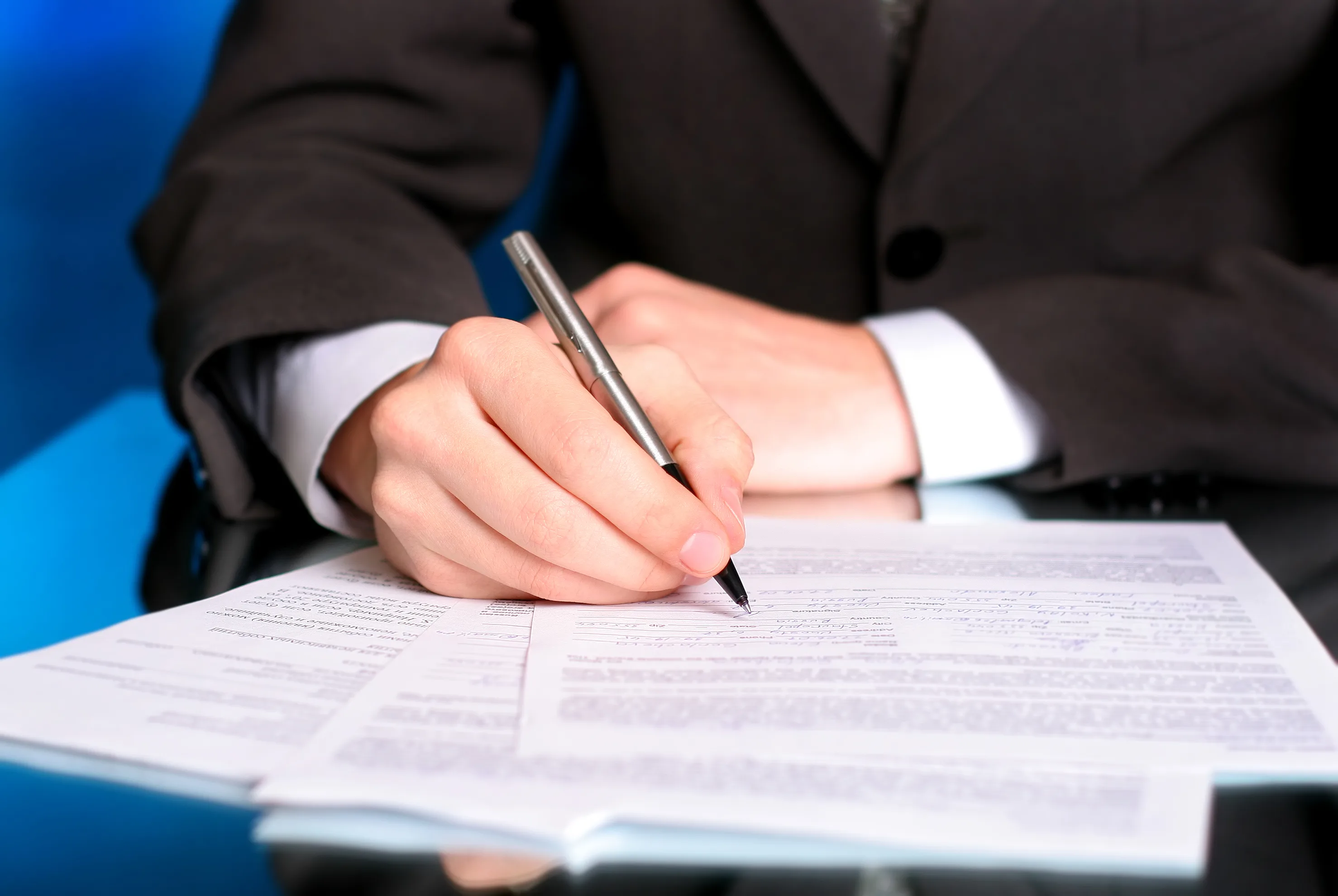 Foreign worker reviewing Work Permit application documents at a Singapore clinic